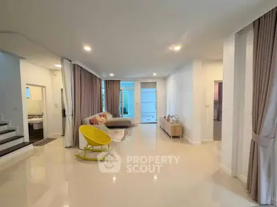 Spacious modern living room with elegant decor and ample natural light