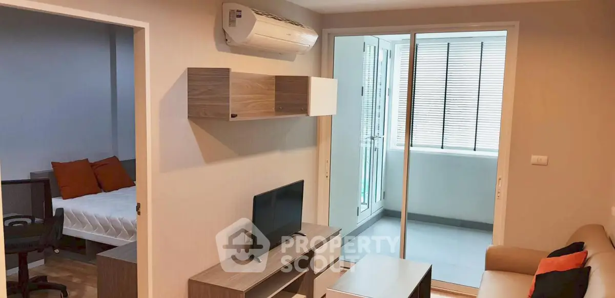 Modern living room with air conditioning and balcony access