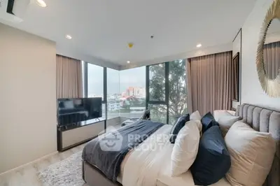 Luxurious bedroom with panoramic city view and modern decor
