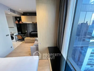 Modern apartment interior with city view, featuring stylish living area and sleek kitchen design.