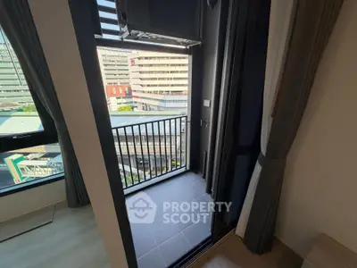 Modern apartment balcony with city view, perfect for urban living.