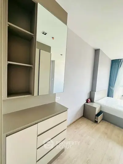 Modern bedroom with sleek furniture and natural light
