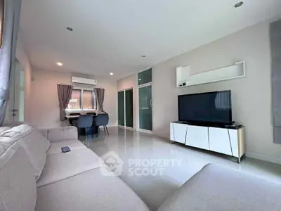 Spacious modern living room with sleek furniture and natural light