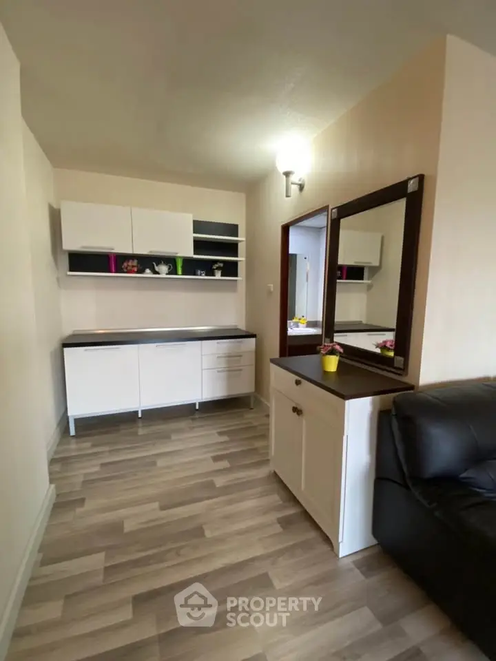 Modern living room with sleek cabinetry and stylish flooring