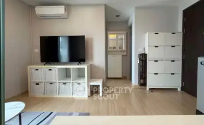 Modern living room with sleek TV setup and stylish storage solutions