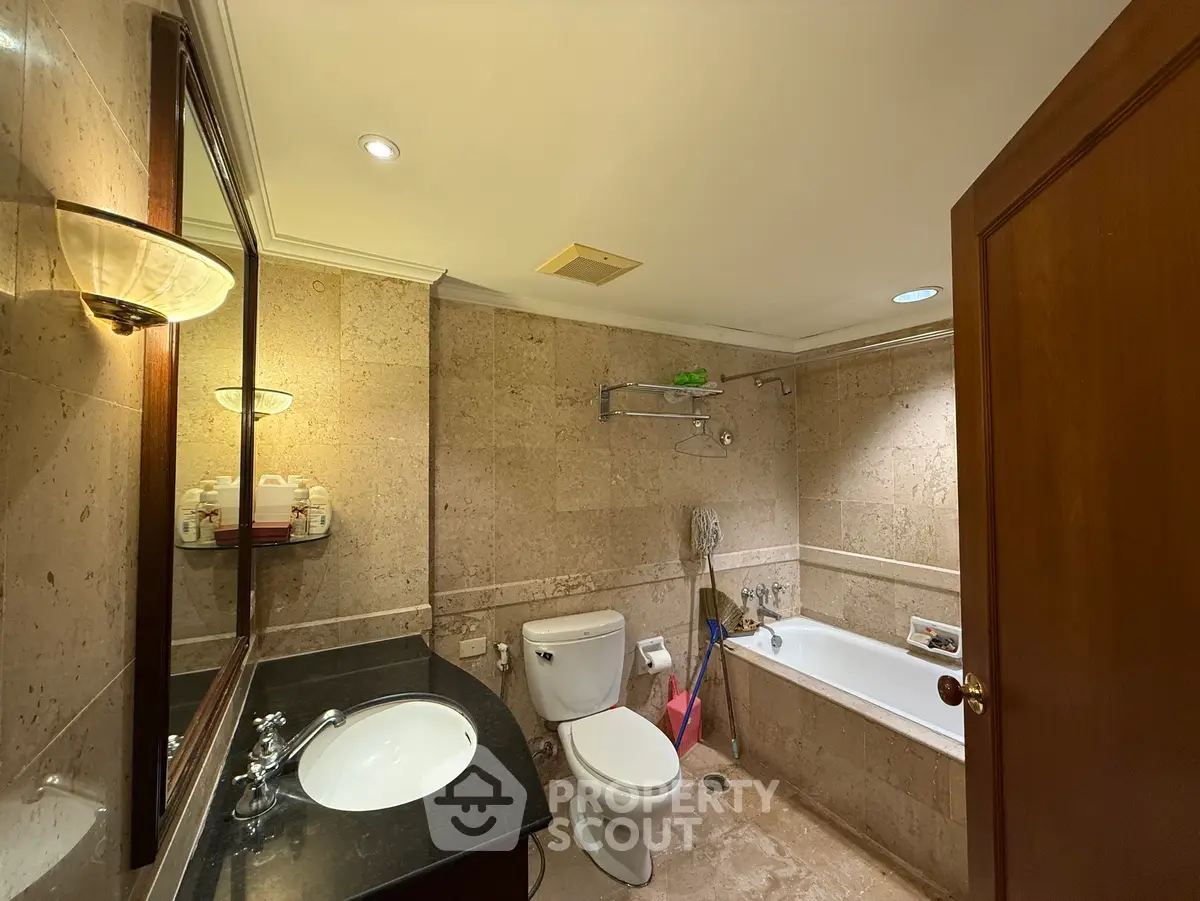 Luxurious bathroom with elegant stone tiles and modern fixtures