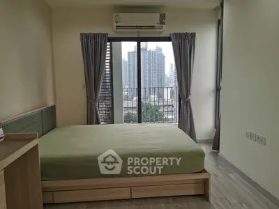 Modern bedroom with city view, featuring a large window and minimalist design.
