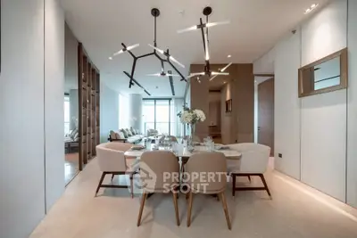 Luxurious modern dining room with elegant lighting and spacious seating in a high-end apartment.