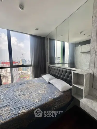 Luxurious high-rise bedroom with stunning city view and elegant decor