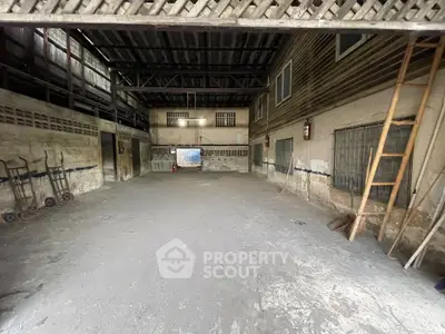 Spacious industrial warehouse with high ceilings and ample storage space
