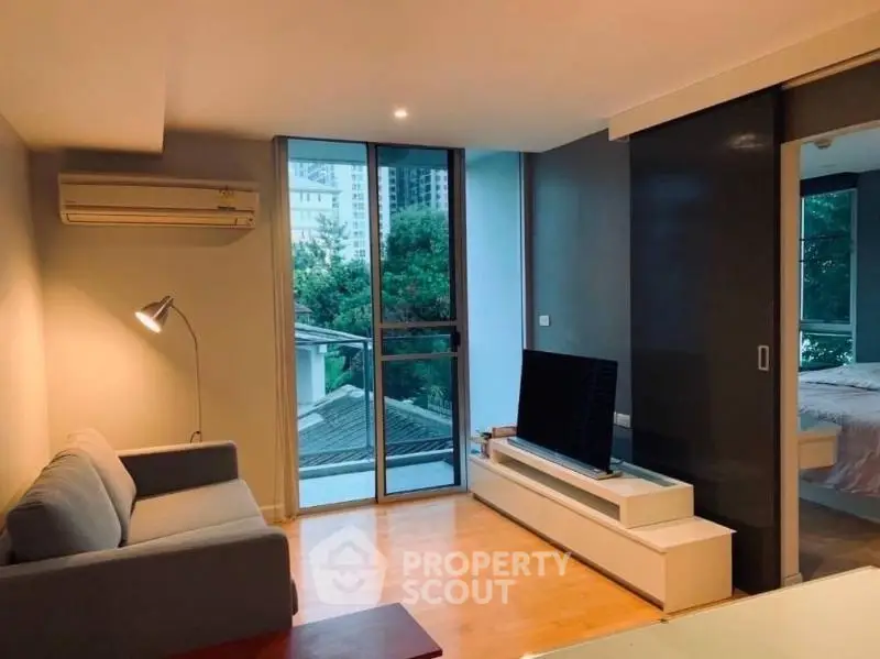 Modern living room with balcony and sleek design in urban apartment