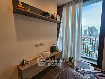 Modern living room with balcony view of city skyline
