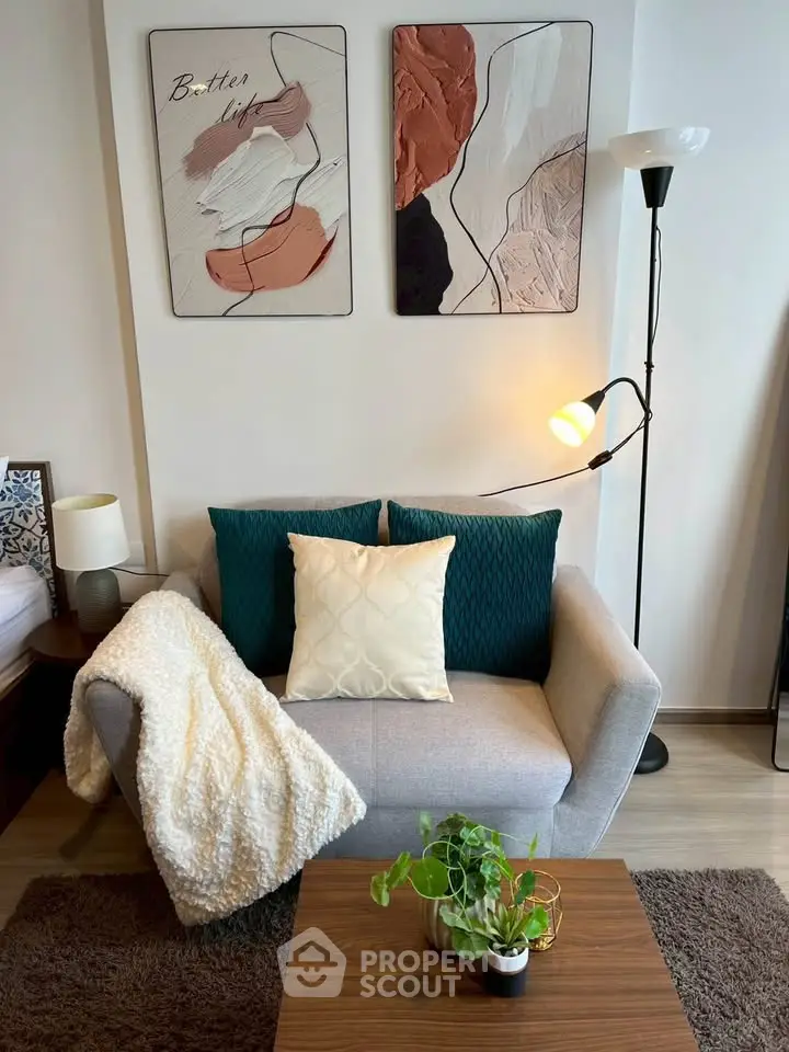 Cozy living room with modern decor and stylish artwork, perfect for relaxation and comfort.