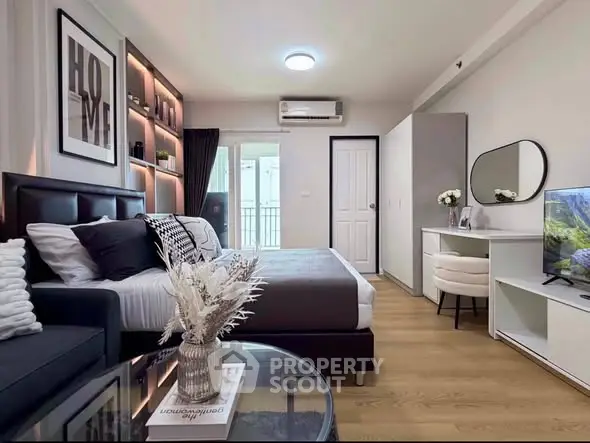 Modern bedroom with stylish decor, cozy bed, and elegant vanity in a chic apartment.
