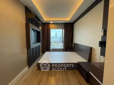 Modern bedroom with city view, featuring sleek wooden accents and ambient lighting.