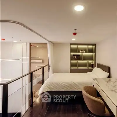 Modern bedroom with sleek design and elegant furnishings in a stylish apartment.