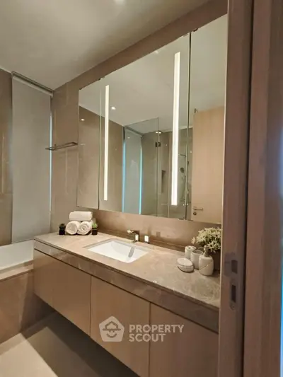 Luxurious modern bathroom with elegant fixtures and spacious vanity