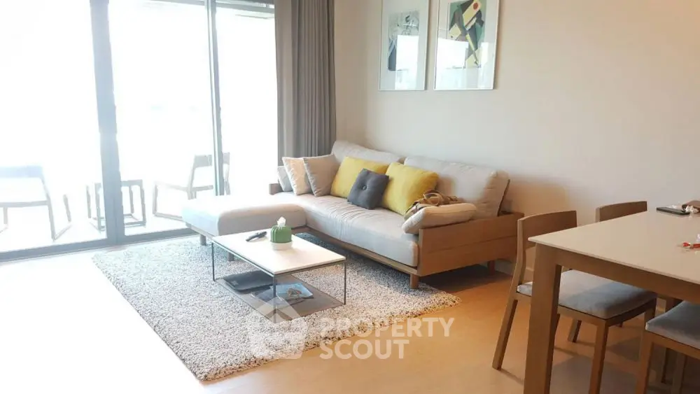 Modern living room with cozy sofa and stylish decor in bright apartment