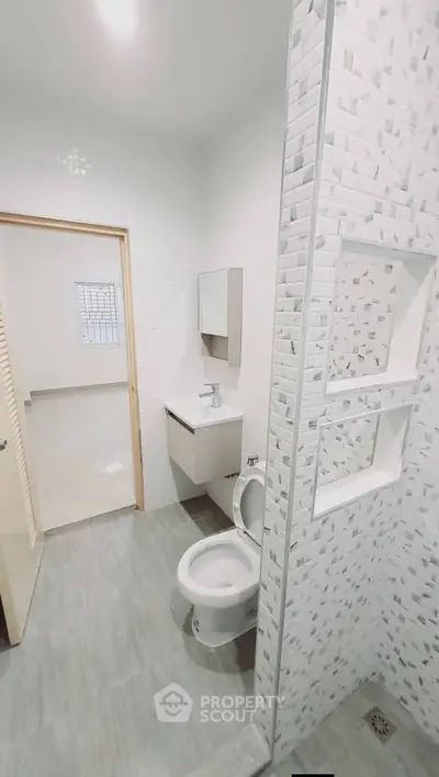 Modern bathroom with sleek design and tiled shower area