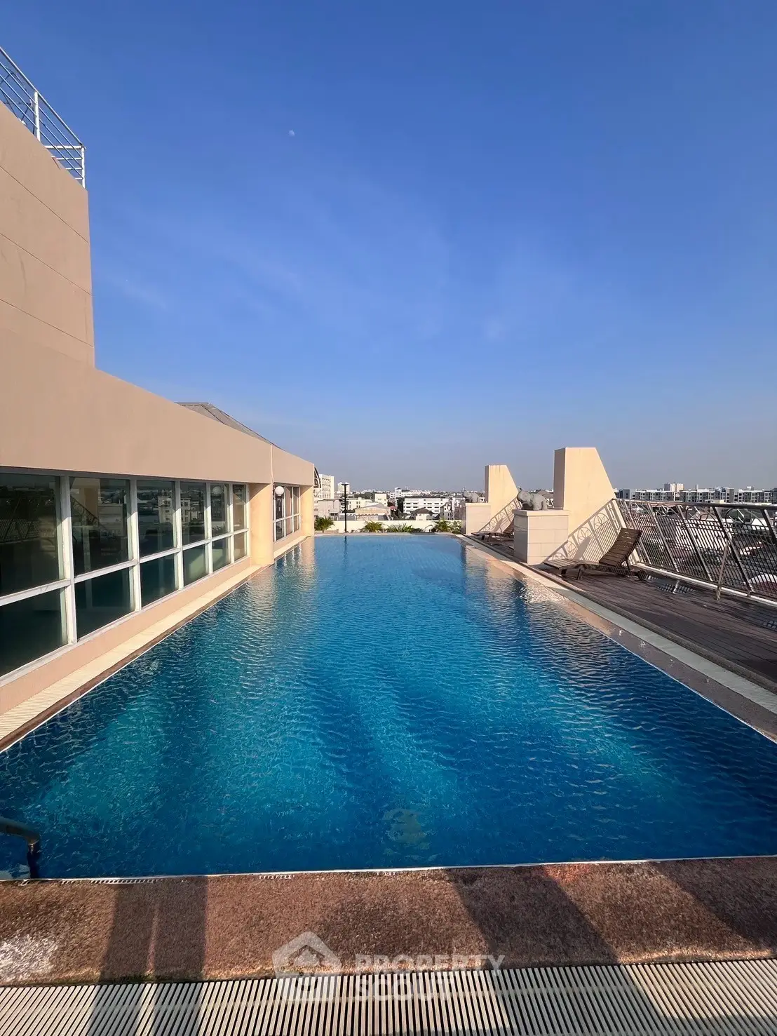 Stunning rooftop infinity pool with panoramic city views, perfect for luxury living.