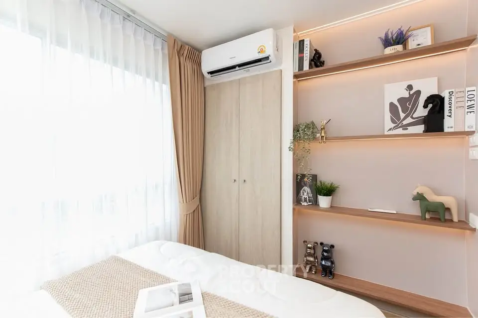 Modern bedroom with stylish decor and ample natural light