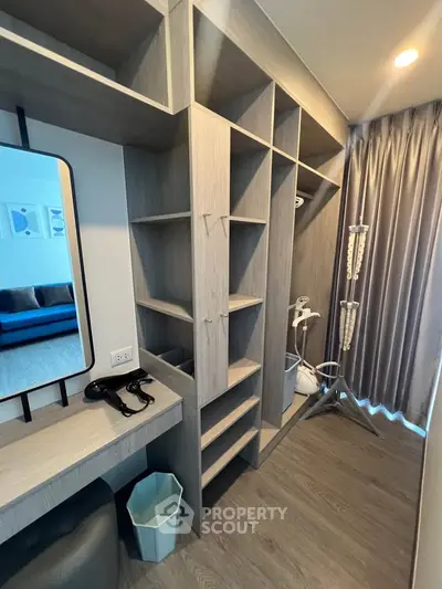 Modern walk-in closet with ample shelving and stylish design
