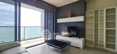 Modern living room with ocean view and sleek furniture