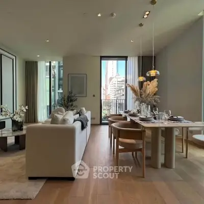 Luxurious open-plan living and dining area with elegant decor and city view, perfect for modern urban living.