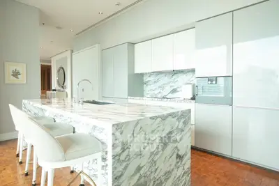 Luxurious modern kitchen with marble island and sleek cabinetry
