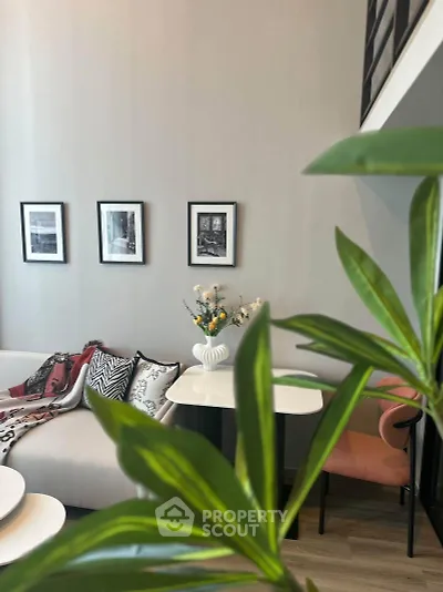 Stylish modern living room with elegant decor and cozy seating area.