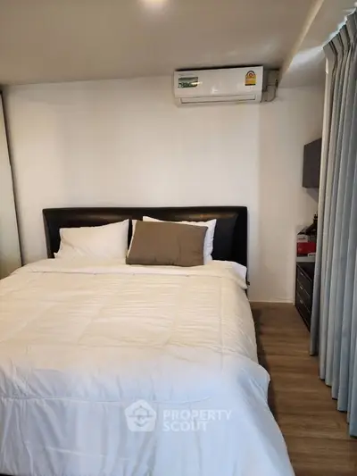Cozy bedroom with modern air conditioning and elegant decor