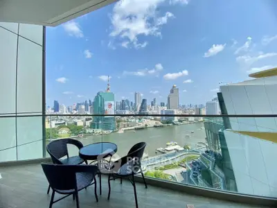 Stunning balcony view of city skyline and river, perfect for urban living.