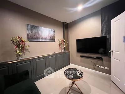 Modern living room with sleek TV setup and stylish decor