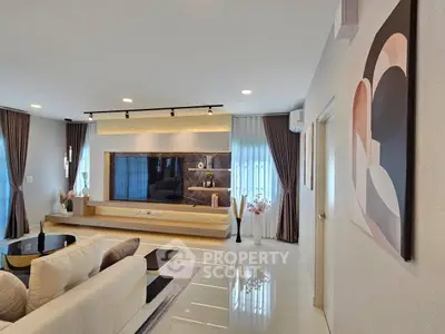 Luxurious modern living room with elegant decor and large windows for natural light.