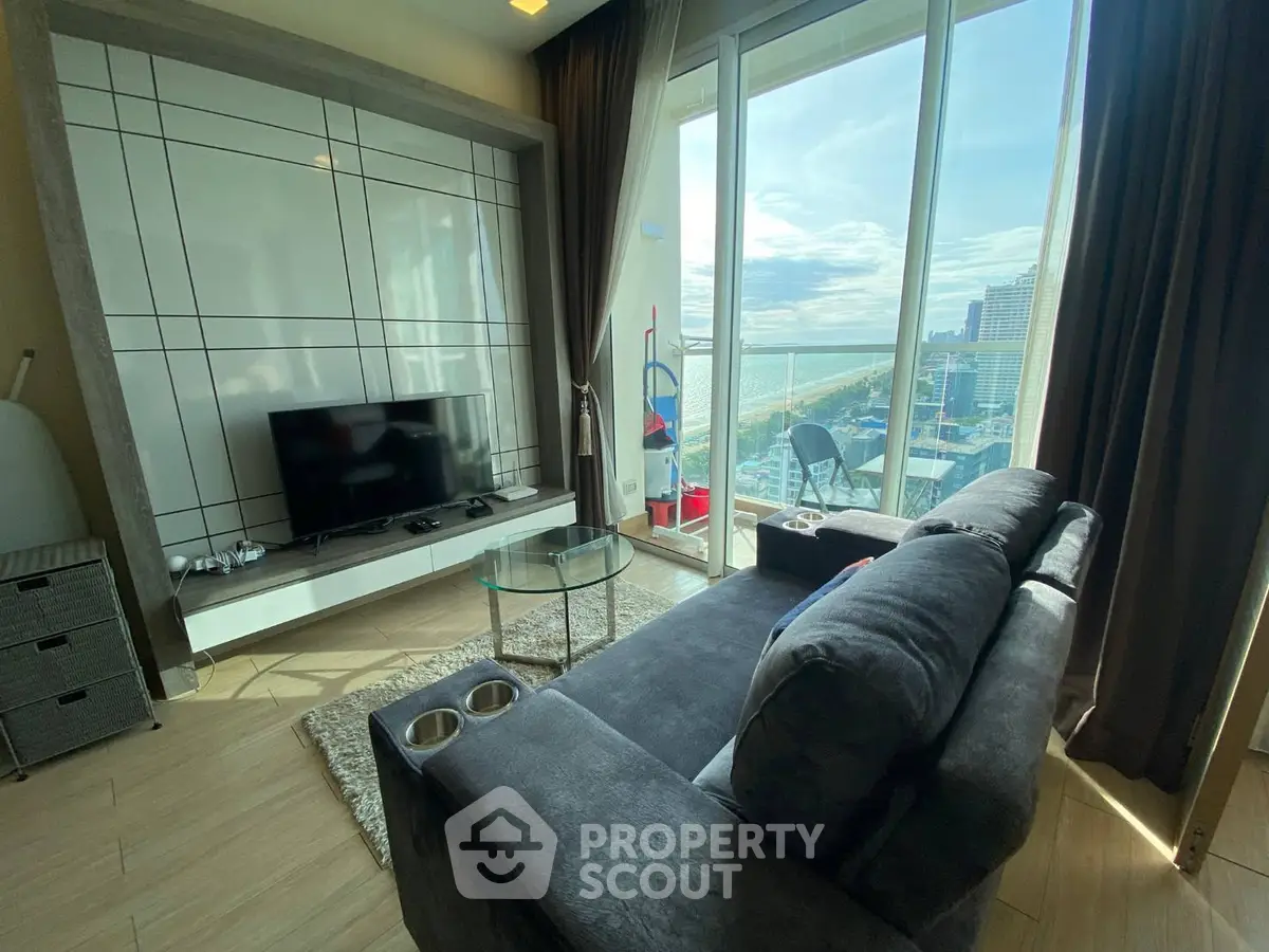 Modern living room with stunning city view and sleek furnishings