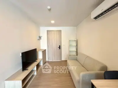 Modern living room with sleek furniture and air conditioning in a cozy apartment.