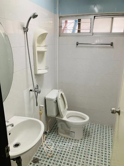 Compact bathroom with modern fixtures and tiled flooring