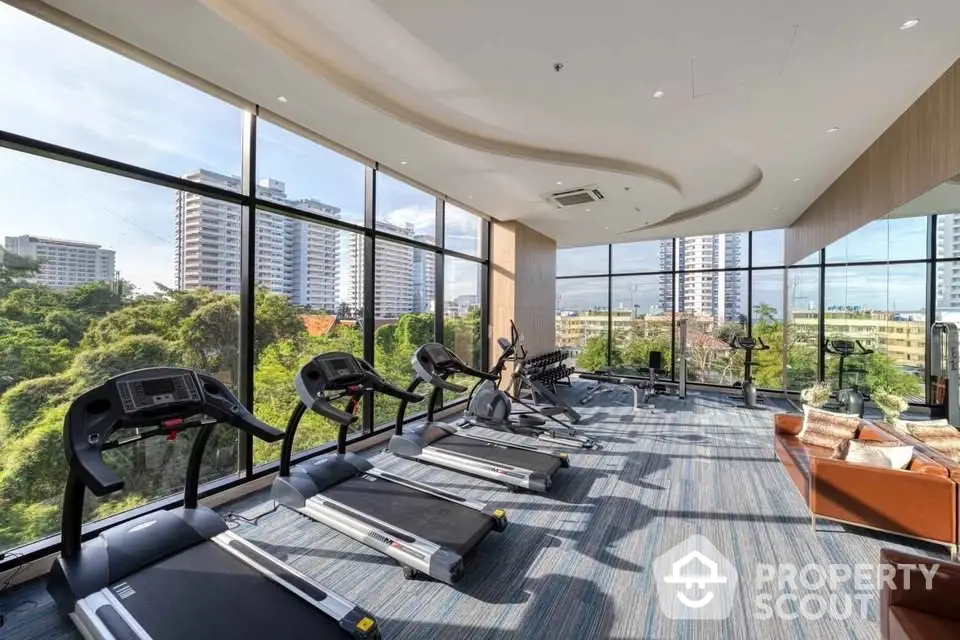 Luxurious gym with panoramic city views and modern fitness equipment