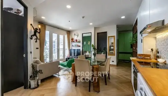 Stylish open-plan living room with modern decor and ample natural light