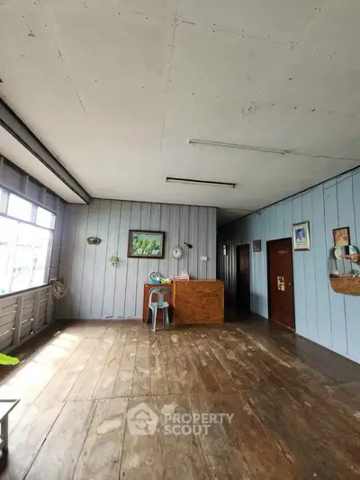 Charming rustic interior with wooden floors and vintage decor, perfect for cozy living.
