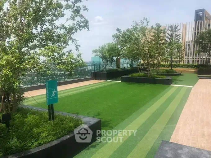 Luxurious rooftop garden with lush greenery and stunning city views.