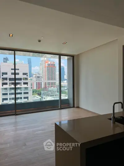 Modern apartment with city view and sleek kitchen island