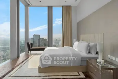 Luxurious bedroom with floor-to-ceiling windows offering stunning city views.