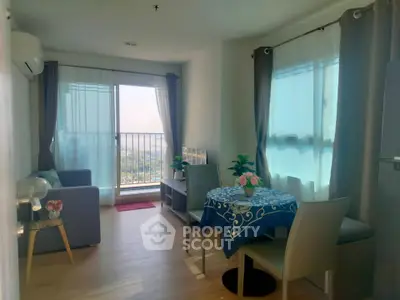Bright and cozy living room with balcony view in modern apartment