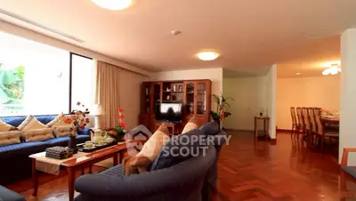 Spacious living room with elegant decor and large windows for natural light.