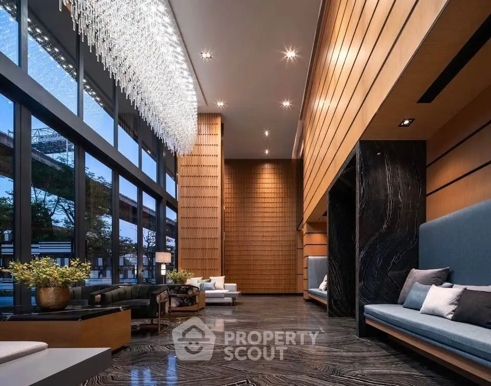 Luxurious modern living room with high ceilings and elegant chandelier