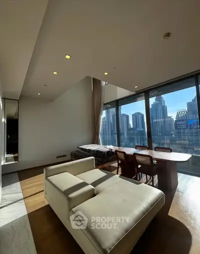 Luxurious high-rise living room with stunning city skyline view and modern furniture.