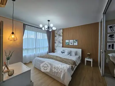Luxurious bedroom with modern decor and ample natural light