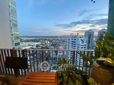 Stunning cityscape view from a modern balcony at sunset, perfect for urban living enthusiasts.