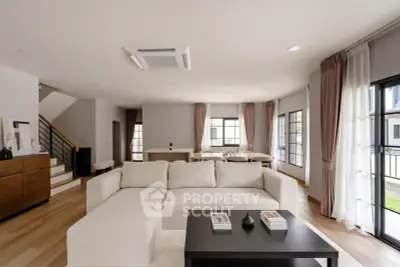 Spacious modern living room with elegant decor and natural light
